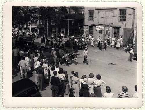 100th Hambletonian Anniversary Parade: Ox cart in front of the A. B. Lord’s Blacksmith shop. Riding in cart: Mark K. Laroe & Mary Weymar; Wm. Rumsey in bib overalls
John Weymer owned cart. Thursday May 5, 1949 chs-003476
